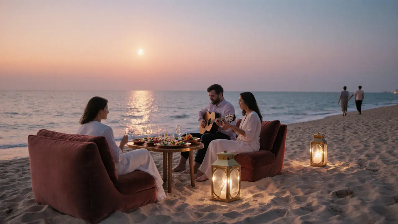 Couples dining on sand at La Mer with golden sunset reflecting on the Persian Gulf.