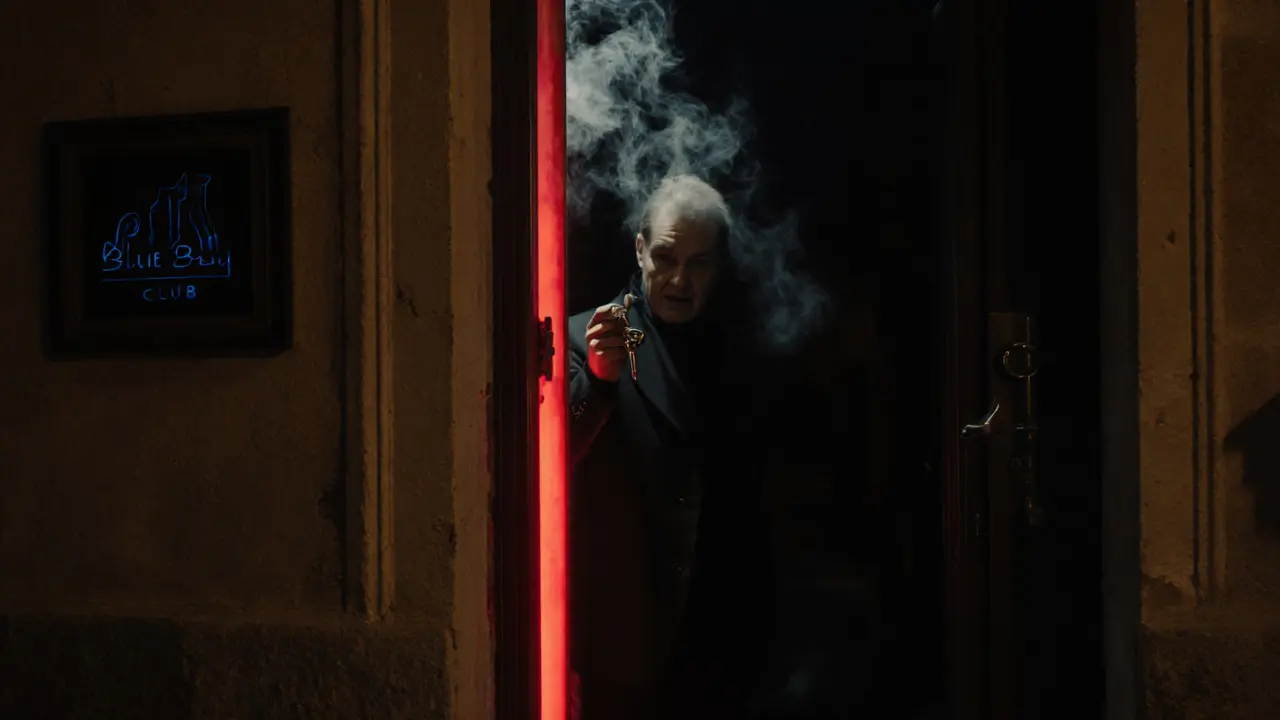 Hidden entrance to Blue Bay club in Monaco, dim red light glowing from a narrow door in a shadowy alley at night.