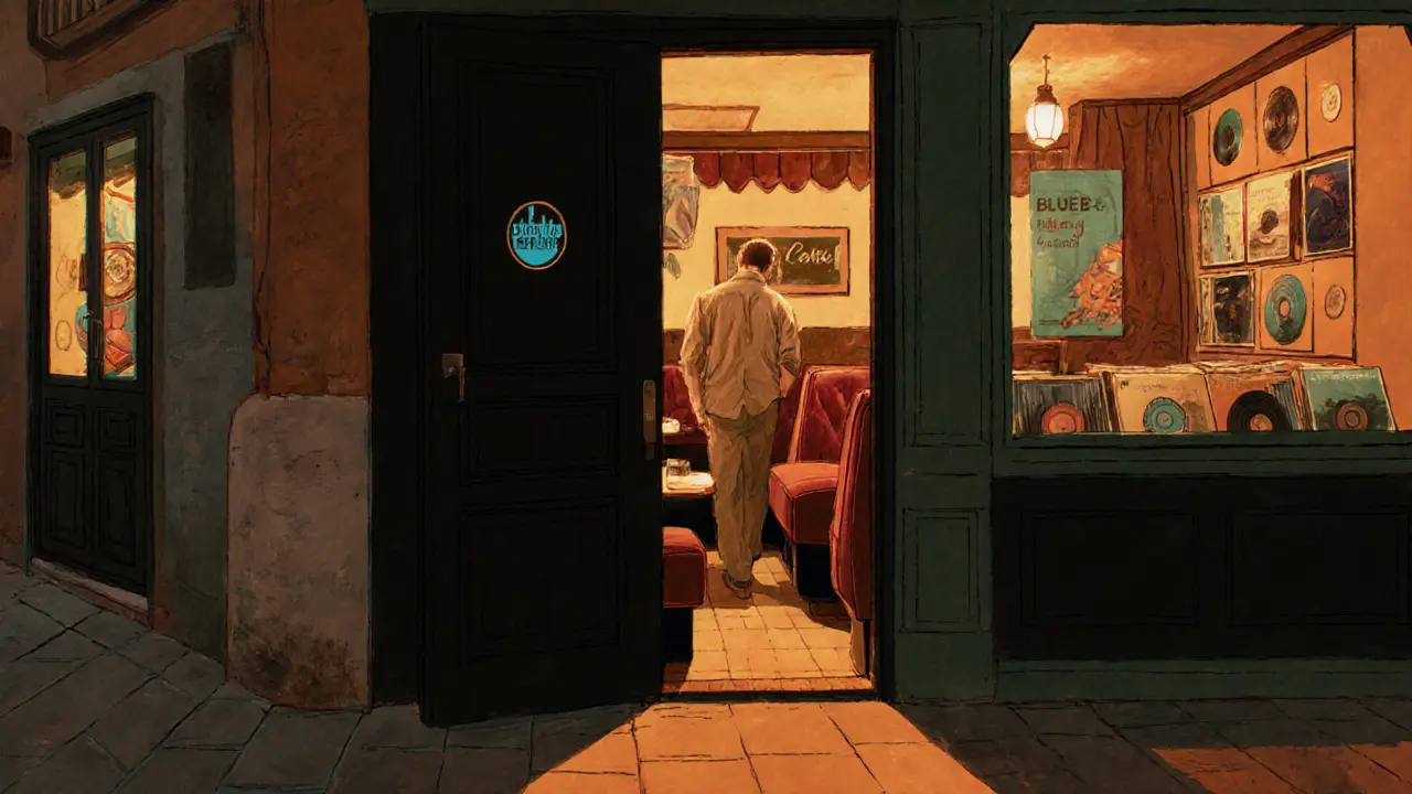 Hidden entrance to Blue Bay club with warm light glowing from a black door beside a restaurant.